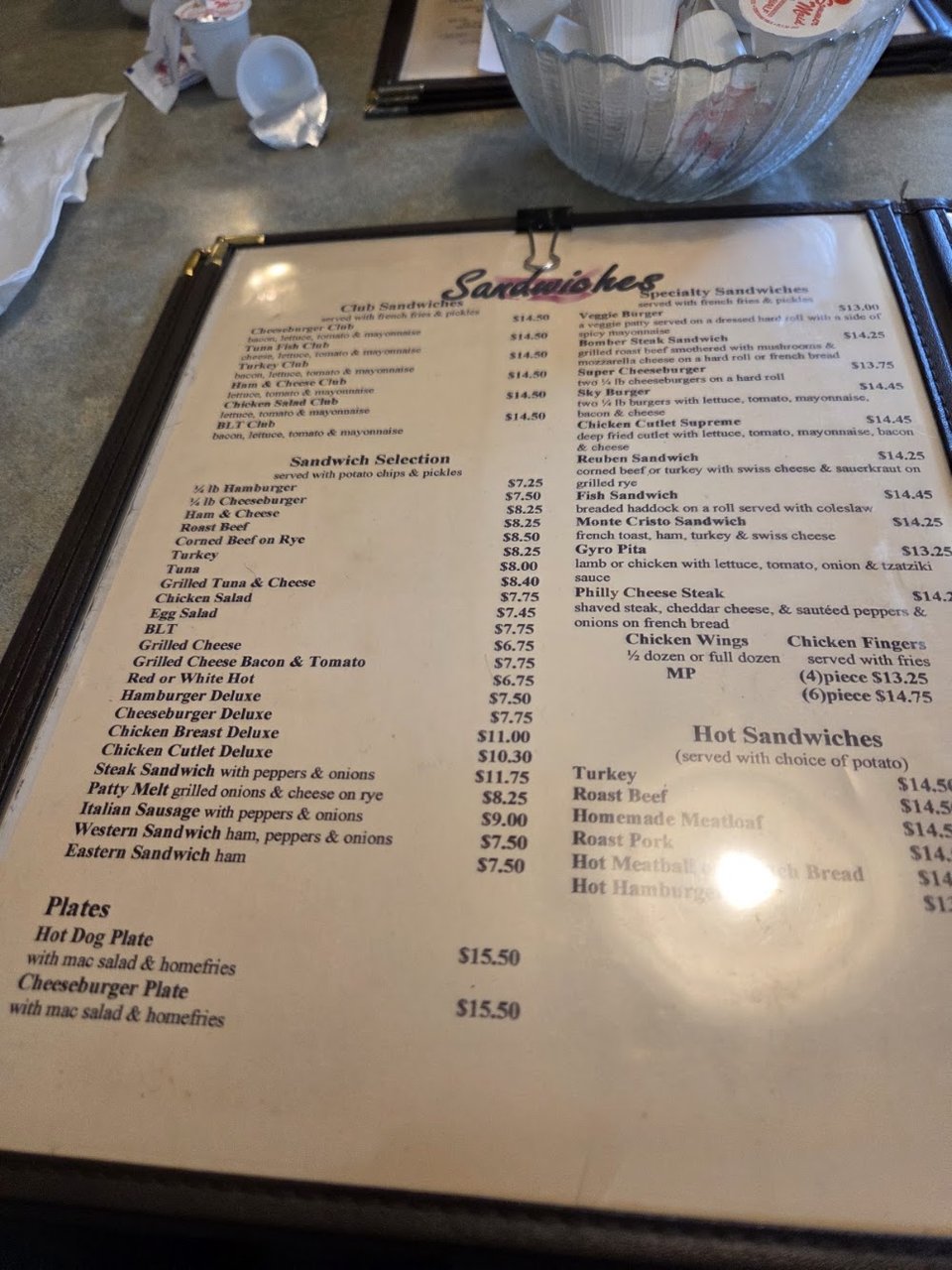 Printed menu with diner breakfasts and sandwiches.